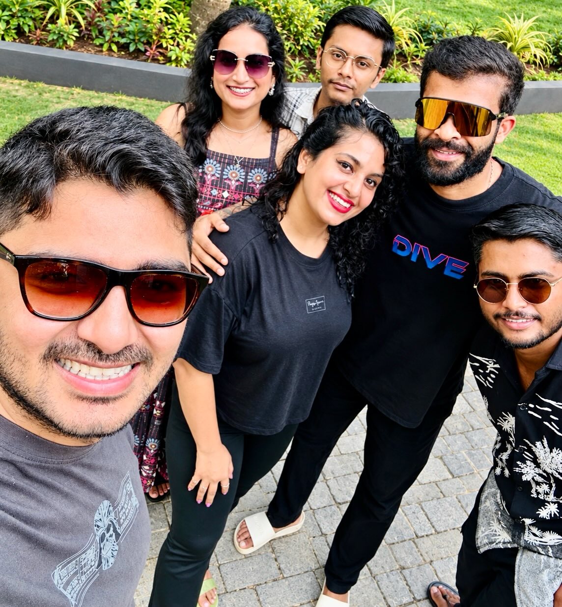 Group selfie of happy guests enjoying their homestay vacation